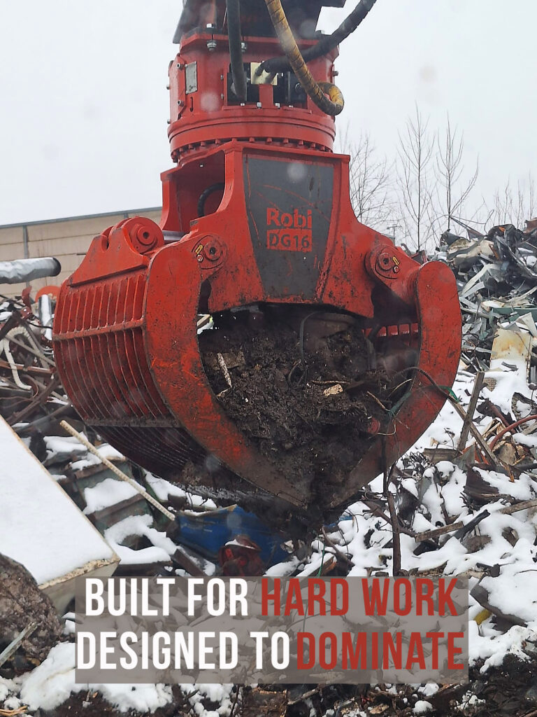 Demolition grapple sorting metal at a recycling site